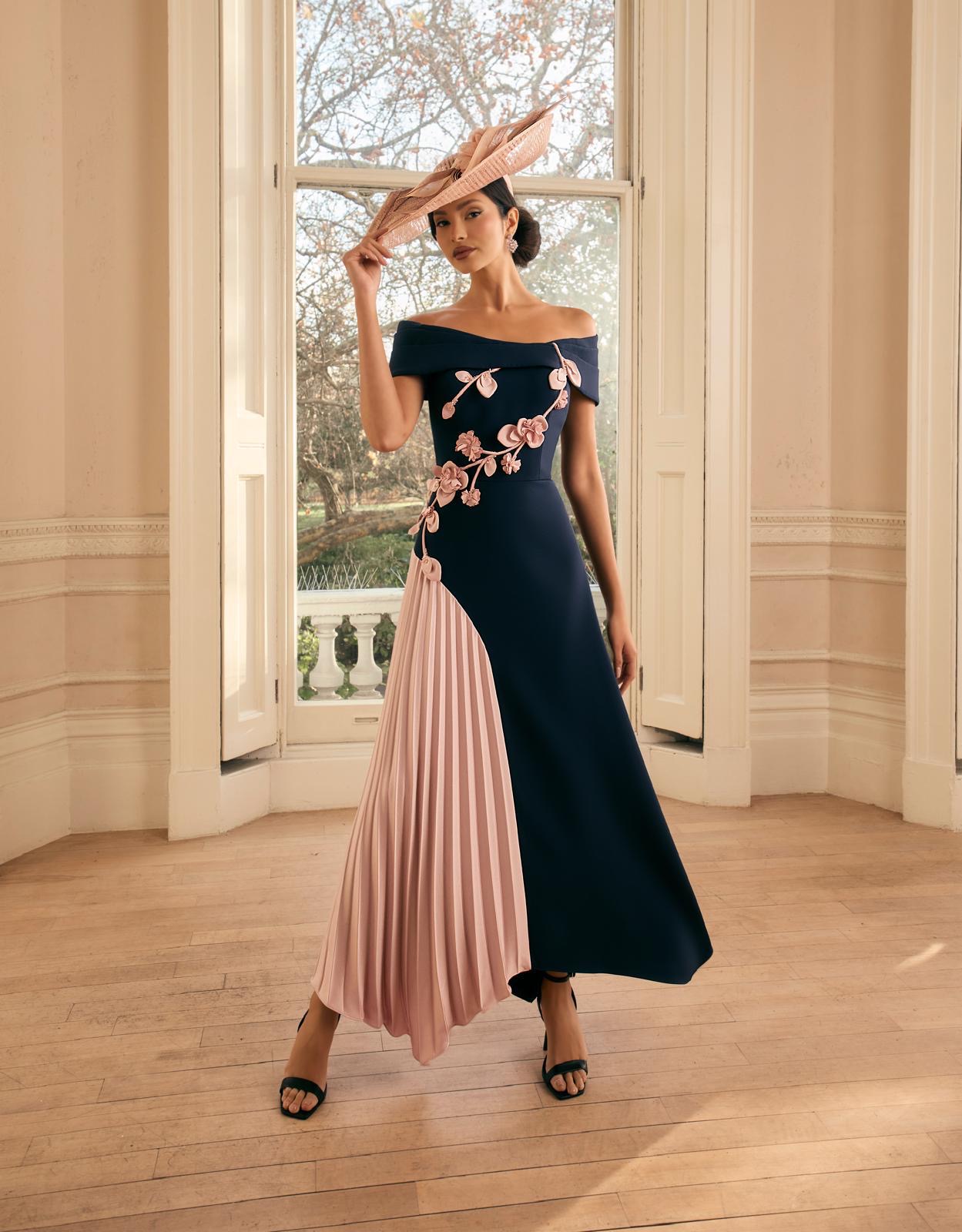 Sophisticated dress combines Modern with Romantic touches dramatic asymmetrical skirt with pleated panel